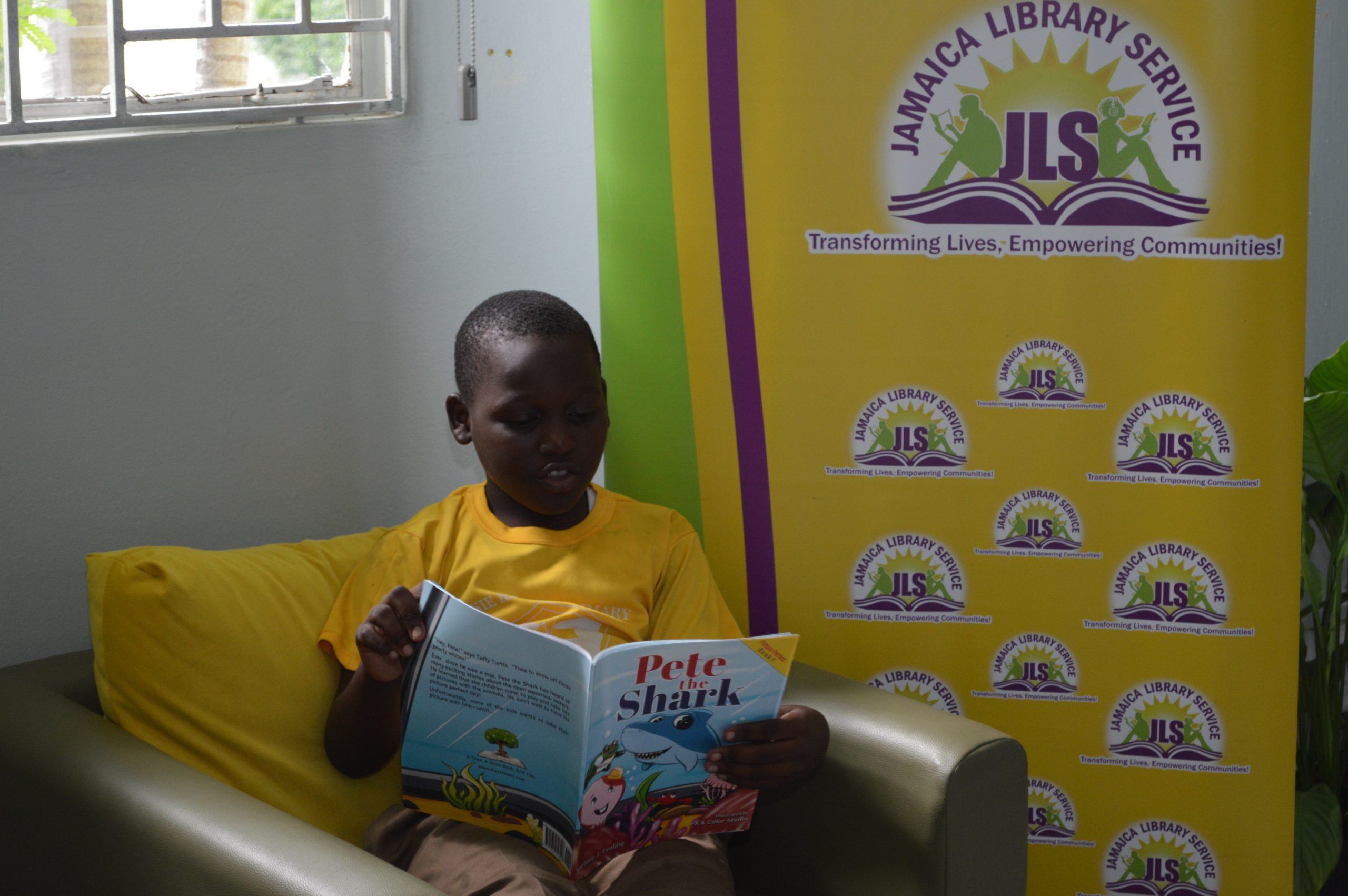 Student reads one of the titles